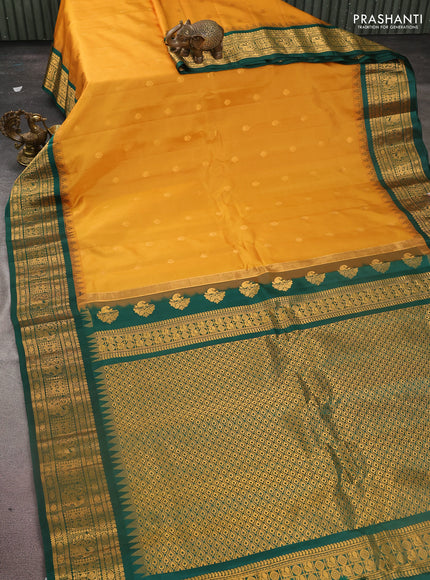 Pure gadwal silk saree mustard yellow and dark green with zari woven buttas and temple design zari woven border