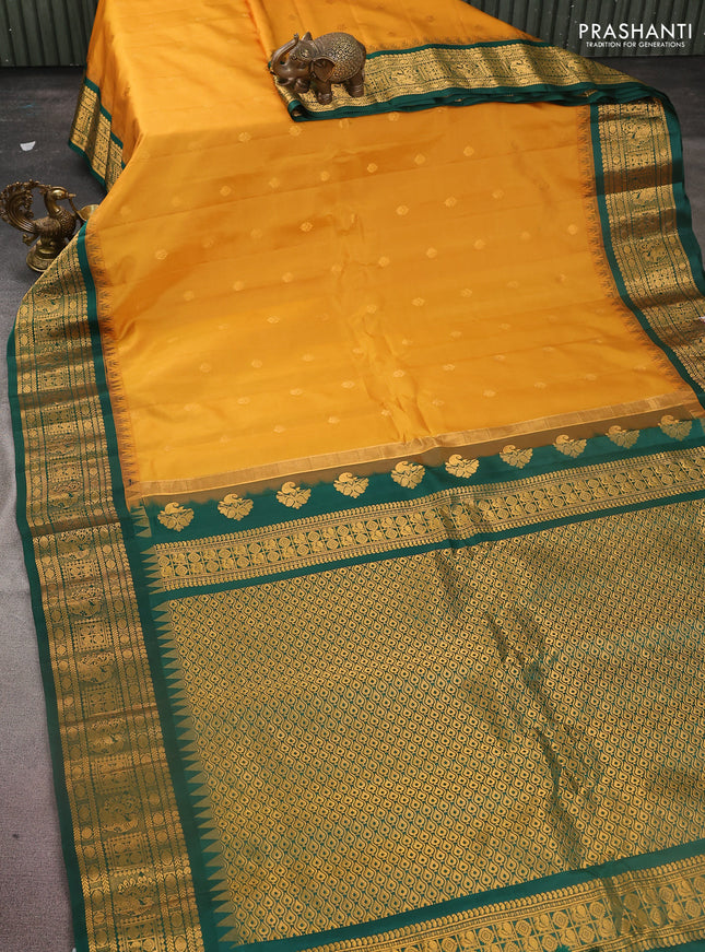 Pure gadwal silk saree mustard yellow and dark green with zari woven buttas and temple design zari woven border