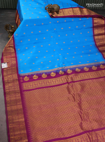 Pure gadwal silk saree cs blue and purple with zari woven buttas and temple design zari woven border