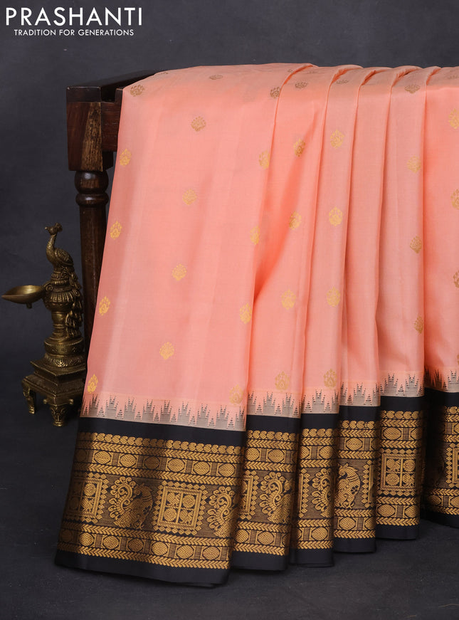 Pure gadwal silk saree peach shade and black with zari woven buttas and temple design zari woven border
