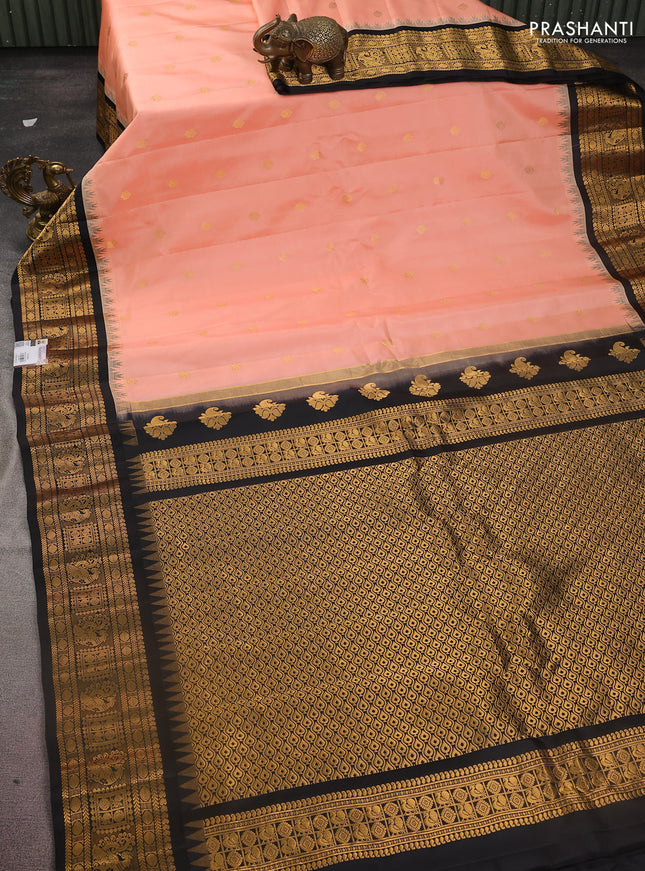 Pure gadwal silk saree peach shade and black with zari woven buttas and temple design zari woven border