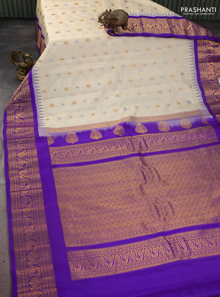 Pure gadwal silk saree cream and blue with silver & gold zari woven buttas and temple design zari woven border