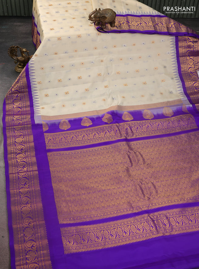 Pure gadwal silk saree cream and blue with silver & gold zari woven buttas and temple design zari woven border