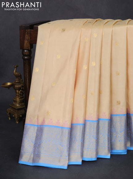 Pure gadwal silk saree cream and light blue with annam zari woven buttas and temple design zari woven border