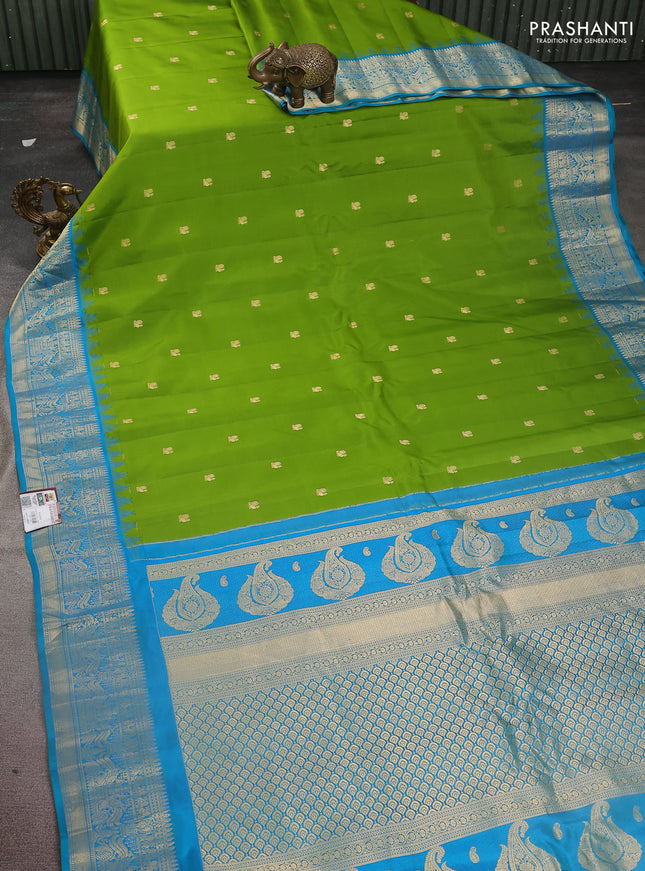 Pure gadwal silk saree light green and cs blue with annam zari woven buttas and temple design zari woven border