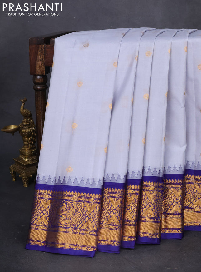 Pure gadwal silk saree grey and dark blue with zari woven buttas and temple design zari woven border