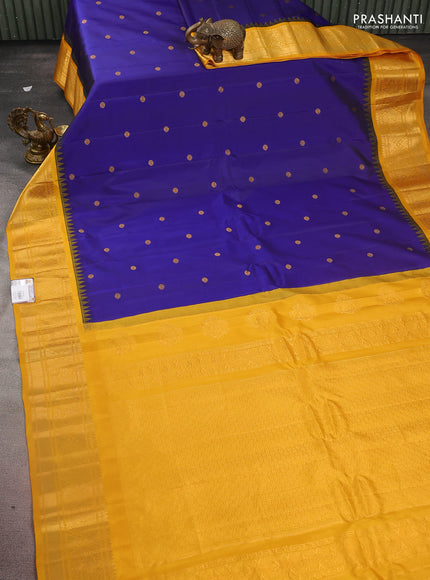 Pure gadwal silk saree dark blue and mustard yellow with zari woven buttas and temple design zari woven border