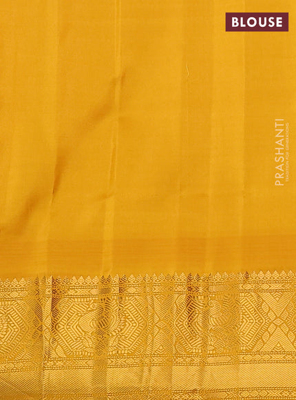 Pure gadwal silk saree dark blue and mustard yellow with zari woven buttas and temple design zari woven border