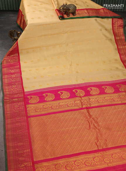 Pure gadwal silk saree sandal and purple with floral zari woven buttas and zari woven korvai border