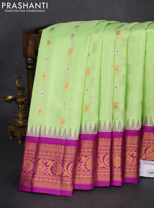 Pure gadwal silk saree pista green and purple with silver & gold zari woven buttas and temple design zari woven border