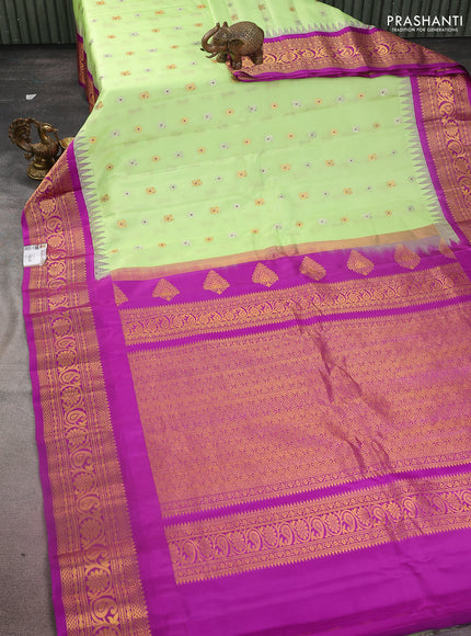 Pure gadwal silk saree pista green and purple with silver & gold zari woven buttas and temple design zari woven border