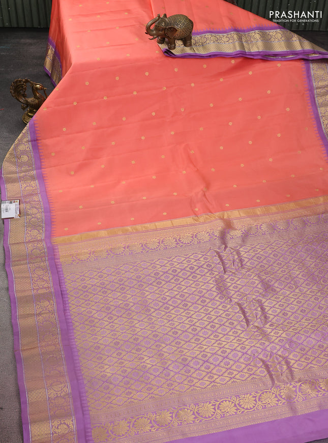Pure gadwal silk saree peach shade and lavender with zari woven buttas and temple design zari woven border