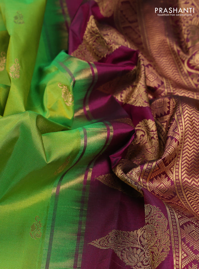 Pure gadwal silk saree light green and dark magenta pink with zari woven buttas and temple design zari woven border