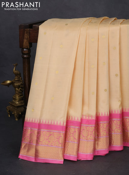 Pure gadwal silk saree sandal and light pink with zari woven buttas and temple design zari woven border