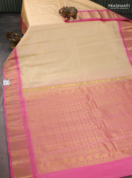 Pure gadwal silk saree sandal and light pink with zari woven buttas and temple design zari woven border