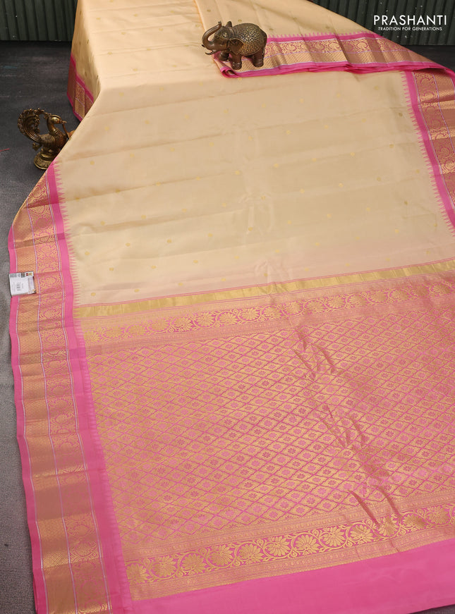 Pure gadwal silk saree sandal and light pink with zari woven buttas and temple design zari woven border
