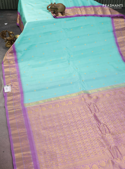 Pure gadwal silk saree teal blue and lavender with zari woven buttas and temple design zari woven border