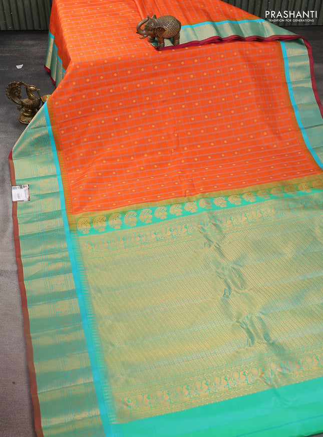 Pure gadwal silk saree orange and dual shade of teal bluish green with allover checked pattern & zari buttas and temple design zari woven border