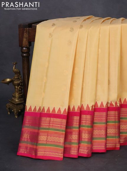 Pure gadwal silk saree sandal and pink with zari woven paisley buttas and temple design zari woven border