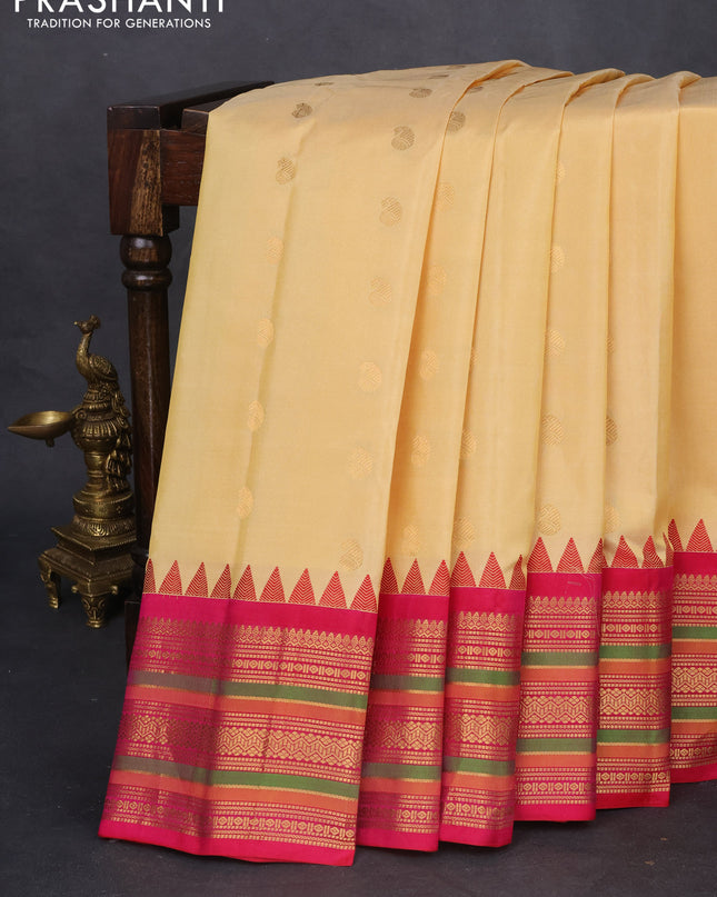 Pure gadwal silk saree sandal and pink with zari woven paisley buttas and temple design zari woven border