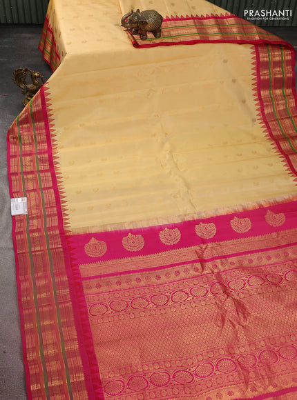 Pure gadwal silk saree sandal and pink with zari woven paisley buttas and temple design zari woven border