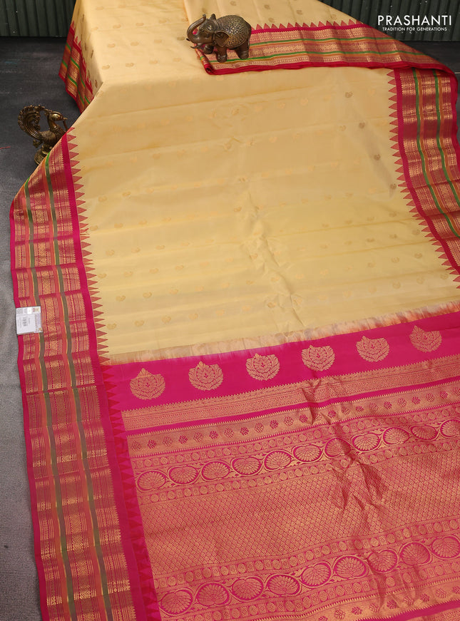 Pure gadwal silk saree sandal and pink with zari woven paisley buttas and temple design zari woven border