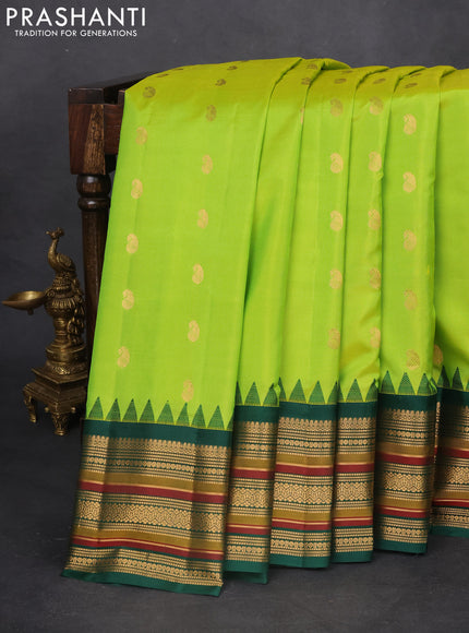 Pure gadwal silk saree dual shade of light green and green with zari woven paisley buttas and temple design zari woven border