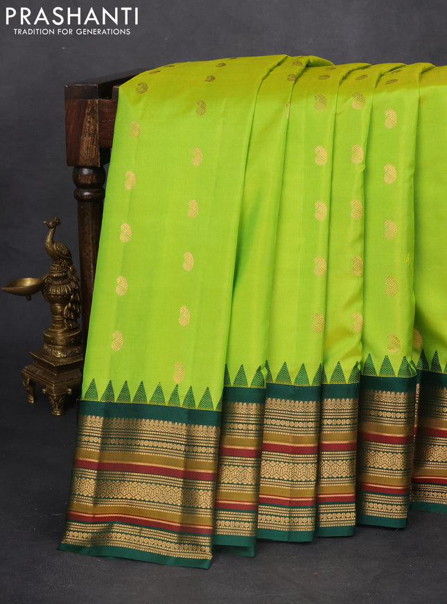 Pure gadwal silk saree dual shade of light green and green with zari woven paisley buttas and temple design zari woven border