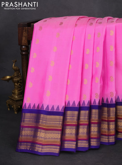 Pure gadwal silk saree light pink and blue with zari woven paisley buttas and temple design zari woven border