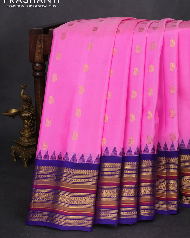 Pure gadwal silk saree light pink and blue with zari woven paisley buttas and temple design zari woven border