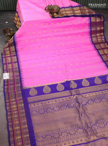Pure gadwal silk saree light pink and blue with zari woven paisley buttas and temple design zari woven border