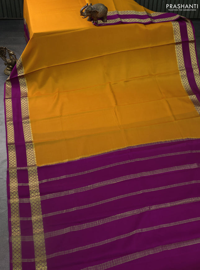Pure mysore silk saree mango yellow and purple with plain body and rettapet zari woven border