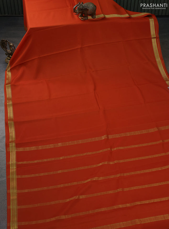 Pure mysore silk saree rustic orange with plain body and zari woven border