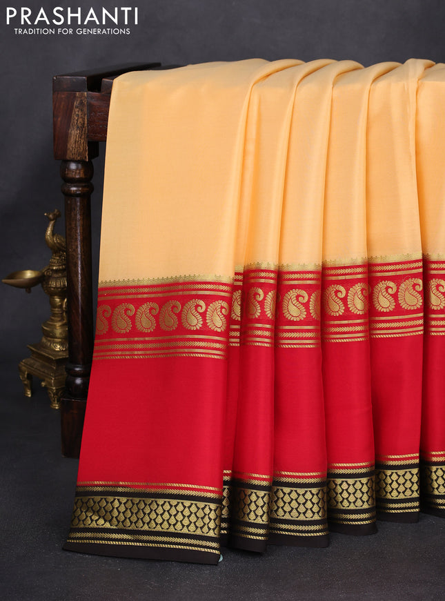 Pure mysore silk saree pale orange and red black with plain body and long rettapet zari woven border