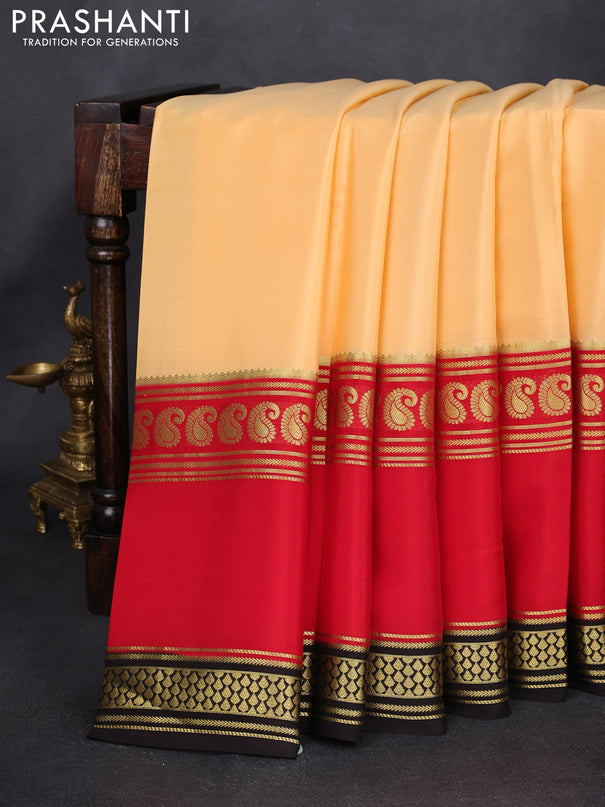 Pure mysore silk saree pale orange and red black with plain body and long rettapet zari woven border