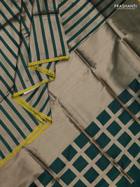 Banarasi tissue partly saree gold and green with plain body and piping border