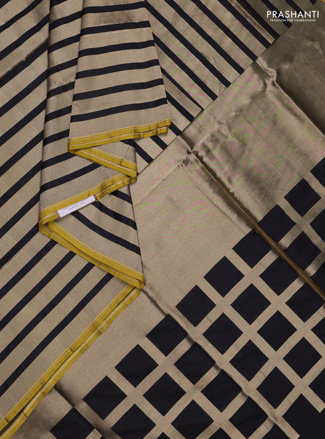 Banarasi tissue partly saree gold and black with plain body and piping border