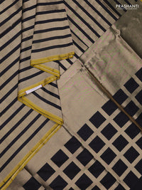 Banarasi tissue partly saree gold and black with plain body and piping border