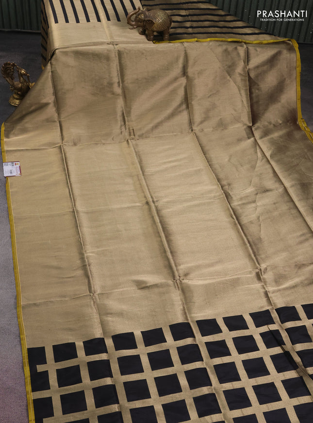 Banarasi tissue partly saree gold and black with plain body and piping border