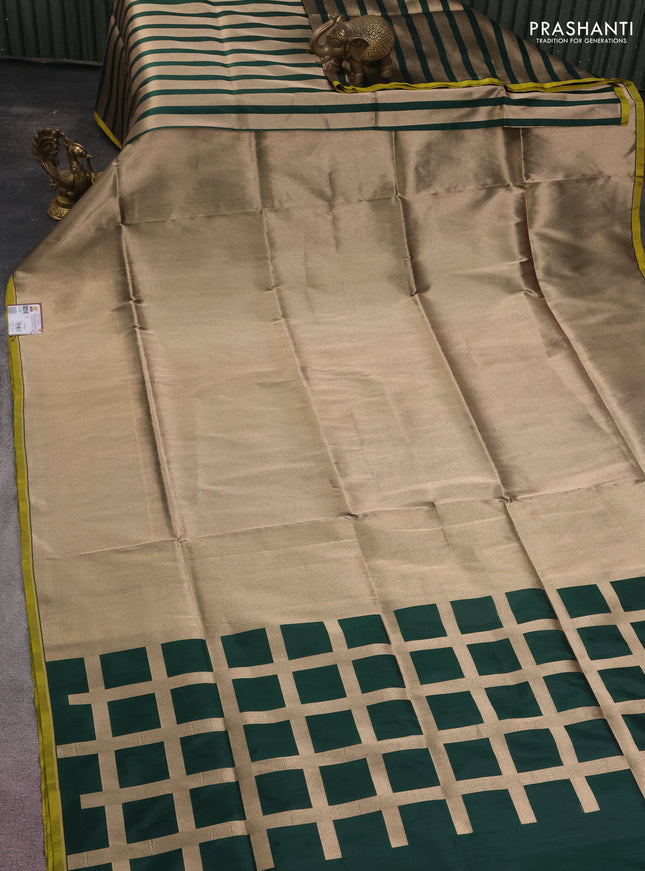 Banarasi tissue partly saree gold and green with plain body and piping border