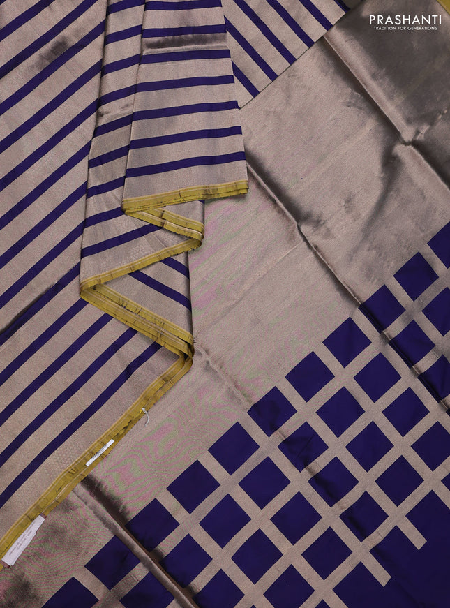 Banarasi tissue partly saree gold and navy blue with plain body and piping border