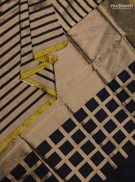 Banarasi tissue partly saree gold and black with plain body and piping border