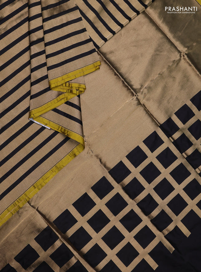 Banarasi tissue partly saree gold and black with plain body and piping border