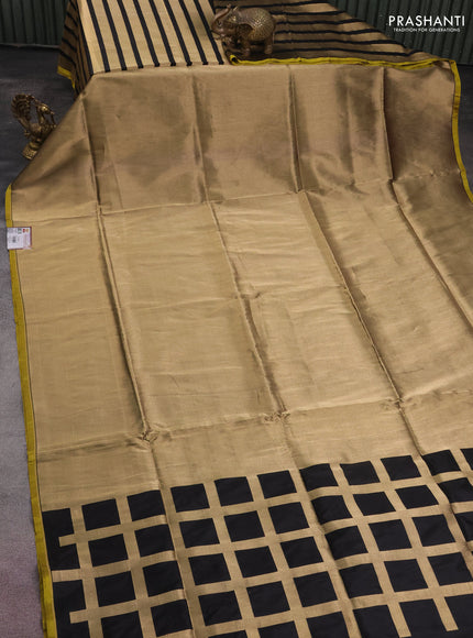 Banarasi tissue partly saree gold and black with plain body and piping border