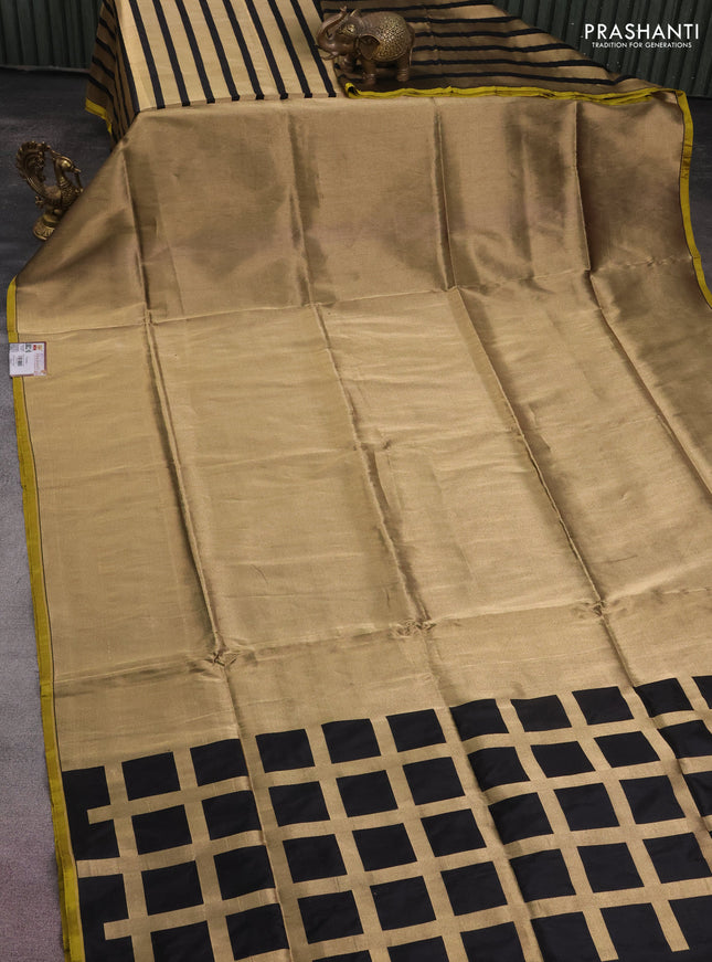 Banarasi tissue partly saree gold and black with plain body and piping border