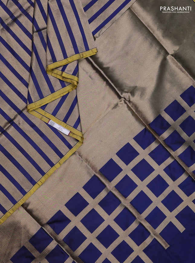 Banarasi tissue partly saree gold and navy blue with plain body and piping border