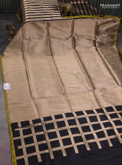 Banarasi tissue partly saree gold and black with plain body and piping border