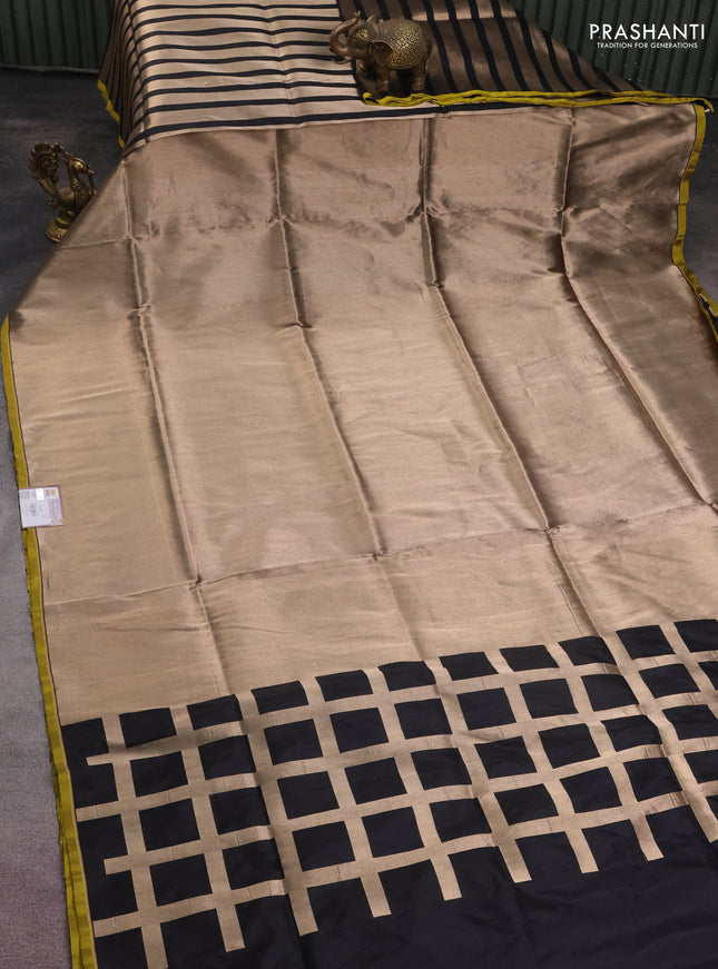 Banarasi tissue partly saree gold and black with plain body and piping border