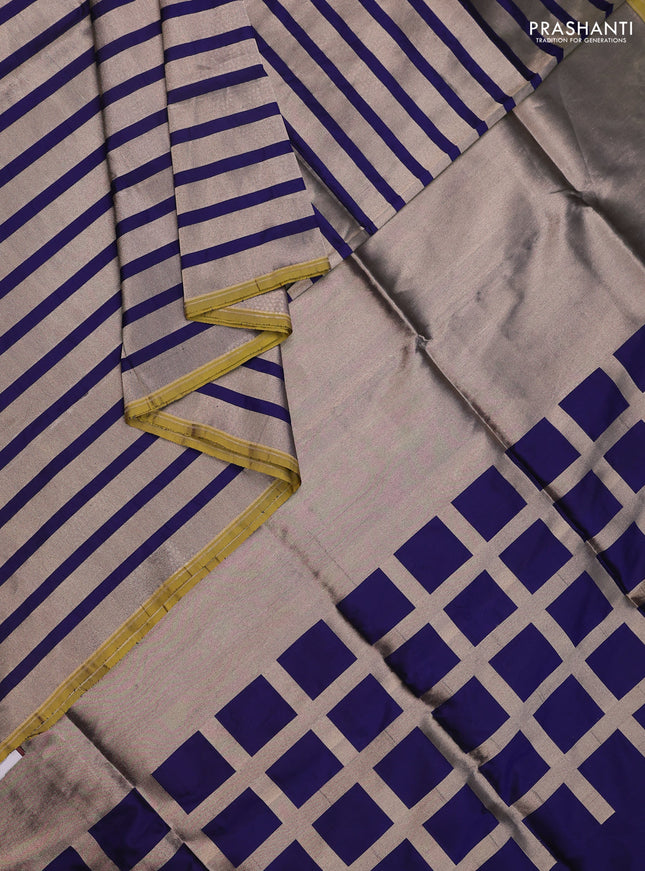 Banarasi tissue partly saree gold and navy blue with plain body and piping border