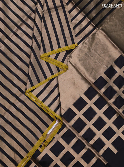 Banarasi tissue partly saree gold and black with plain body and piping border